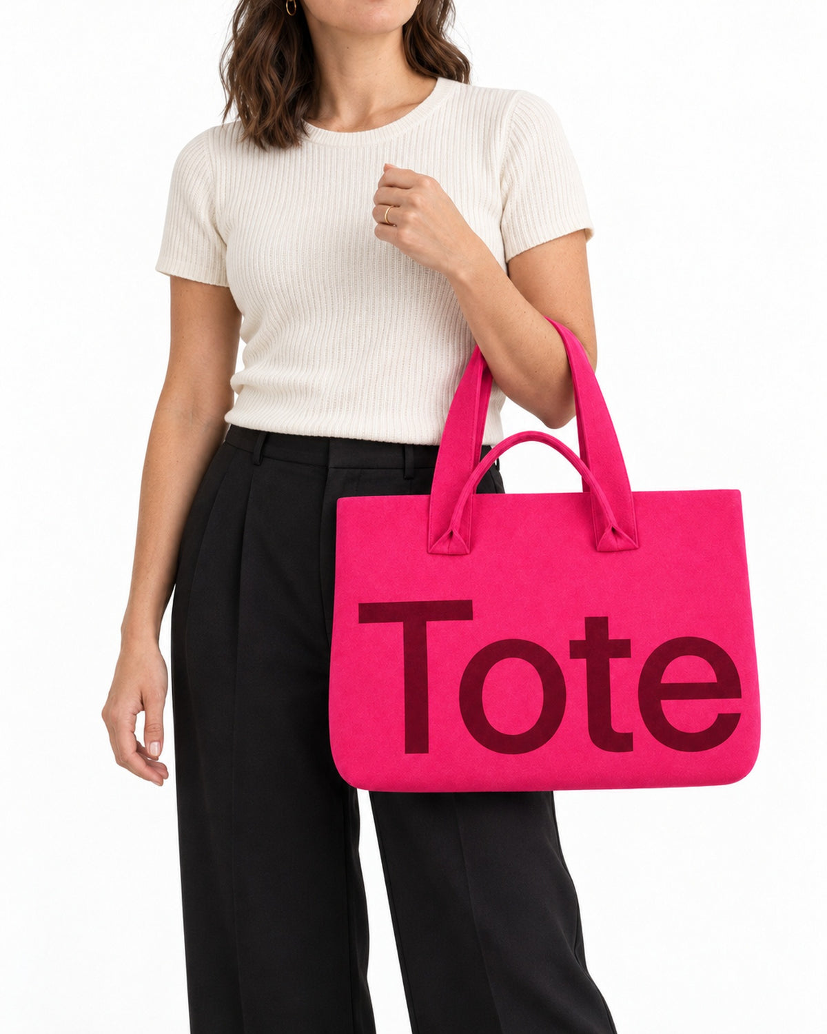 The Tribeca Tote in Hot Pink/Burgundy on a model, studio shot